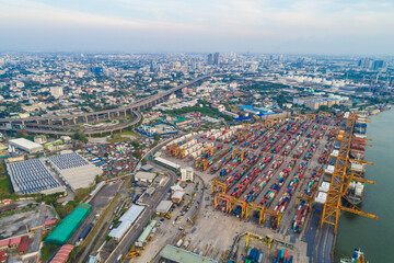 Obraz premium Aerial view shipping crane boat city habour port with container truck city view background
