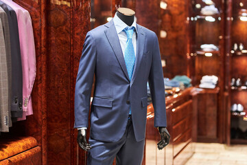 A man's suit on a mannequin in the store. Luxury goods.