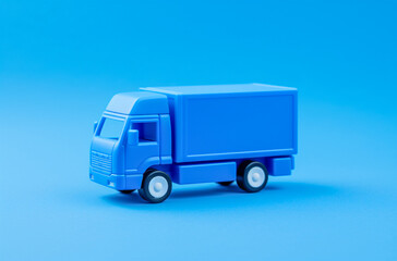 Vibrant Close-Up of Toy Truck on Blue Background, Generative AI