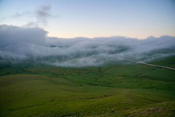 Fototapeta na wymiar aerial view of persembe yaylasi huge fog on sky on plateau