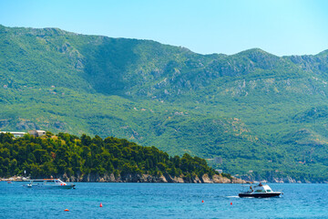 Obraz premium beautiful views of boats and the sea, mountains, tourism and summer travel, Montenegro, Adriatic Sea