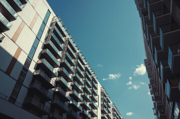 Contemporary residential buildings exterior in the daylight. Modern European residential apartment buildings quarter on a sunny day.