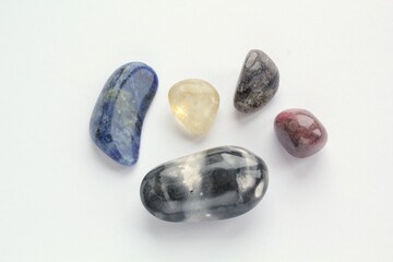 Big set of colored mineral natural gemstone on background. Magical stones for esoteric spiritual practice, crystal ritual, witchcraft. Energetical power concept. Healing therapy