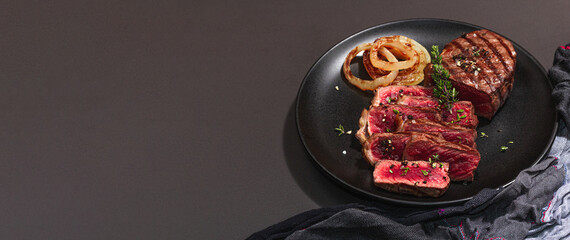 Rare cooking level Sirloin steak with spices and herbs. Classic grilled meat cut ready to eat