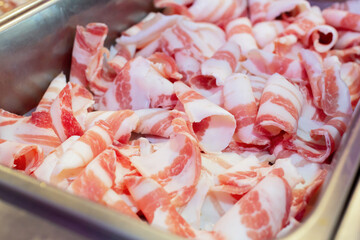 The soft pork slides inside dish. The streaky pork for shabu hotpot