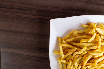 french fries on white dish with freespace for texting.