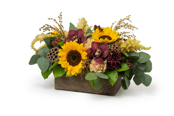 Floral arrangement with sunflowers in a wood box on white background. Fall Autumn season bouquet of flowers. Professional florist, small business.