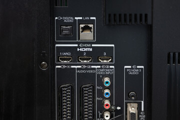 close up of multimedia connection ports for sound and vision HDMI Lan, SCART, audio
