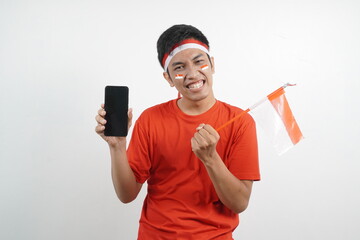 man celebrating independence day showing blank mobile screen with flag.