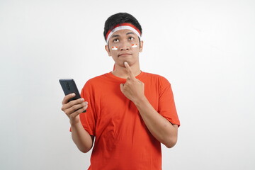 Asian man is celebrating independence day thinking something.