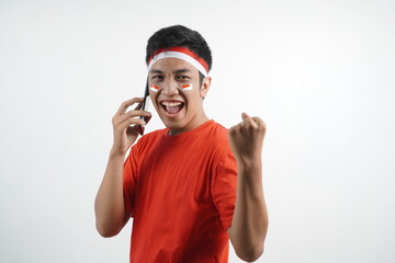 Man celebrating independence is on the phone and win.