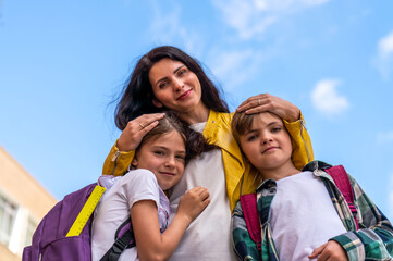 Portrait of a mother and her children on the street