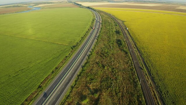 Highway roads of Romania. 4K aerial video with A2 motorway road from Bucharest to Constanta during a beautiful summer sunrise. High speed infrastructure industry.