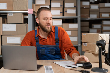 Small business aspiring entrepreneur, small and medium business worker working in warehouse using...