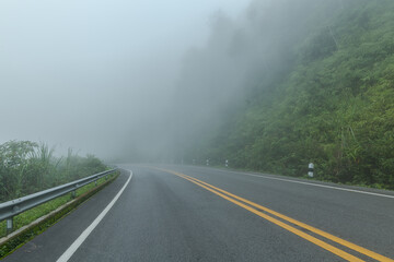 Beautiful asphalt road in the foggy.