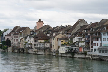 Historical old city of Rheinfelden in Switzerland along the Rhine river. The houses are built close to one another and are used for residential purposes. The silhouette is typical for the town. 