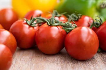 fresh summer cherry tomatoes on a branch