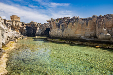 The amazing natural pools of Marina Serra, in Puglia, Salento, Tricase. The clear and crystalline turquoise sea, between the rocky cliff. The blue sky, in the summer.