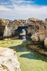 The amazing natural pools of Marina Serra, in Puglia, Salento, Tricase. The clear and crystalline turquoise sea, between the rocky cliff. The blue sky, in the summer.