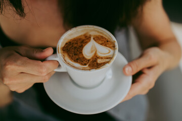 aromatic morning coffee in female hands