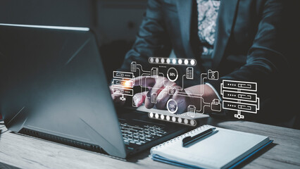 Businessman checking data transfer using laptop computer with data server storage icon for data exchange and transfer concept.