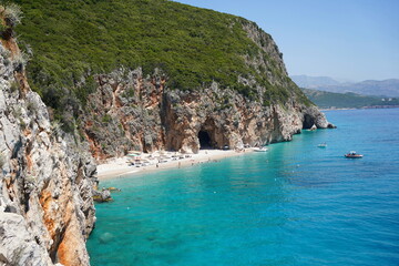 Hidden beach (pirates cave) nera Gjipe Beach, Albania in summer.