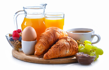 Breakfast served with coffee, orange juice, croissants and egg