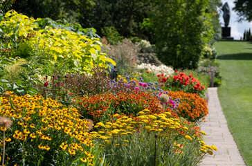 Stunning, colourful mixed flower borders at Wisley Garden, Surrey UK. The extensive flower beds...
