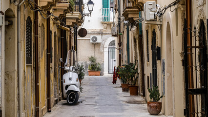 scooter standing at the empty street of old italian town © nehuen