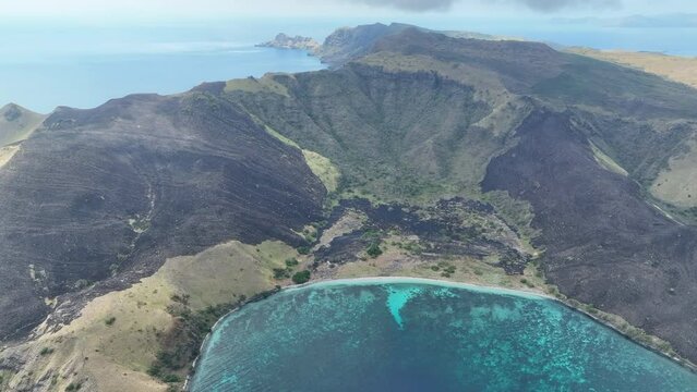 The volcanic island of Gili Banta, not far from Komodo National Park, is surrounded by healthy coral reefs. This beautiful area of Indonesia is known for its astounding marine biodiversity.
