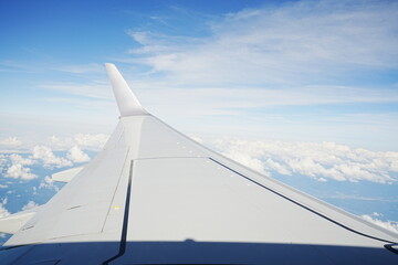 Fototapeta na wymiar Cloudy Sky from Airplane Window - 日本 東京 飛行機からの景色 