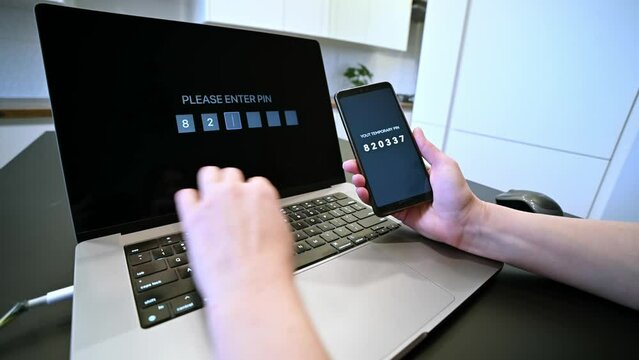 Internet data security. Woman entering his online banking password. Two factor authentication. Digital safety. 