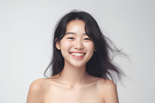 Beaming headshot of a stunning young woman with a radiant smile, set against a clean soft light background. generative AI.