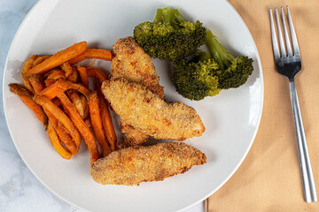 chicken tenders with  broccoli and sweet potato fried