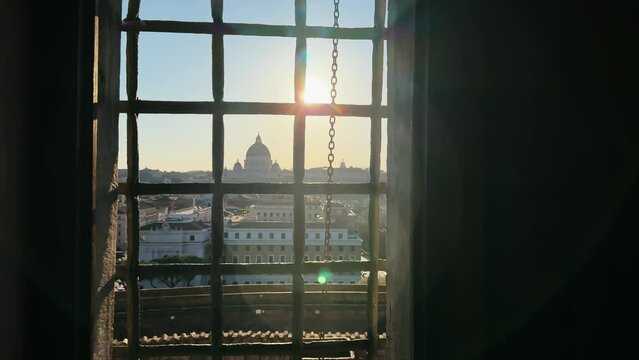 Panoramic sunset view of Rome cityscape from high balcony viewpoint window of Castelo sant Angelo balcony with cathedral St. Peter and Vatican at background, cinematic view