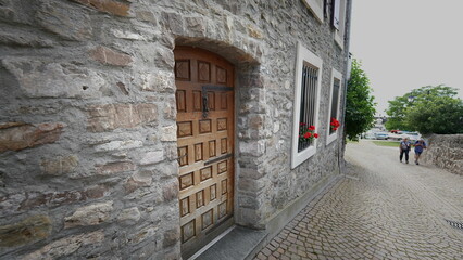 Fototapeta na wymiar MONTREUX SWITZERLAND MARCH 1 2022 Traditional old European front home antique wooden door in street