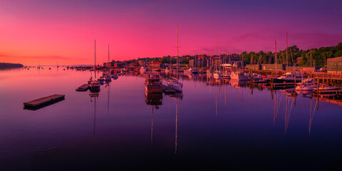 Belfast Harbor at Twilight in Maine. Saturated vibrant and tranquil marina landscape at dawn with...