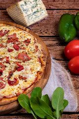 pizza with salami tomatoes and olives