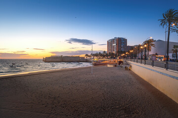 La Caleta Beach and Castle of Santa Catalina at sunset - Cadiz, Andalusia, Spain