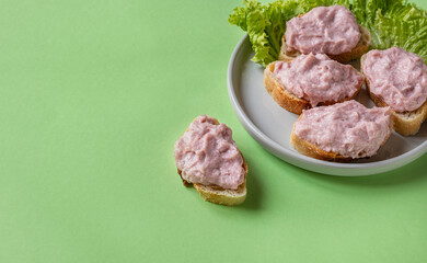 Tarama or taramasalata canape on the green background