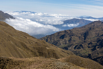 Picturesque mountain view in the remote Bolivian Andes - Traveling and exploring wild places in South America: above the clouds