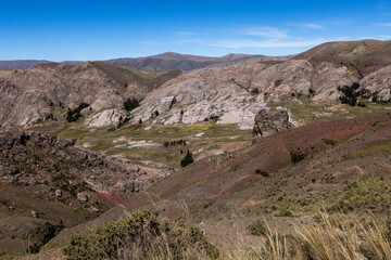 Scenic drive through the remote, peaceful, picturesque and mountainous landscape of the Bolivian Andes - exploring wild places in South America