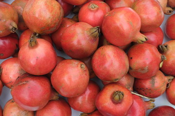 Fototapeta na wymiar Fresh Pomegranates at Farmers market ,direct angle view