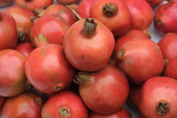Fototapeta na wymiar Group of pomegranates. Pomegranate closeup,