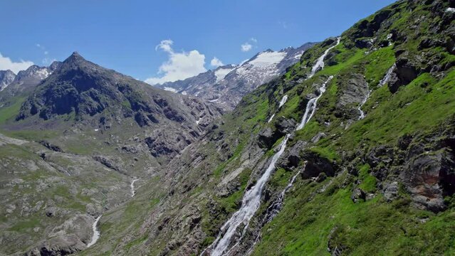 waterfalls in Oetztal &Ouml;tztal valley fly by on a sunny day