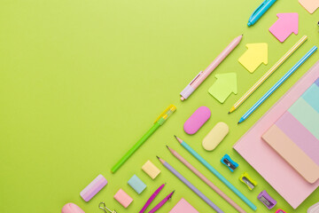 Flat lay with colorful school stationery on color backgroung, top view