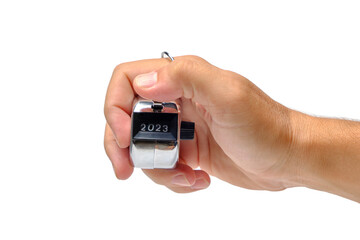 Manual mechanical counter in hand on white background.