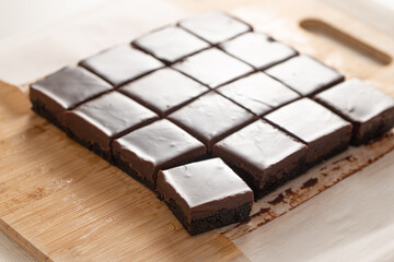 Homemade caramel chocolate brownies with dark chocolate ganache.