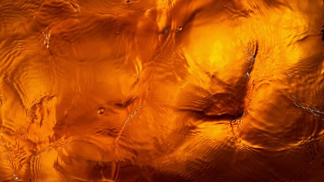 Super Slow Motion Shot of Waving Whiskey Waves at 1000fps.