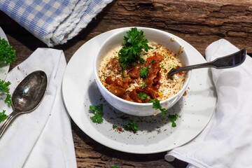 Crab and corn bisque or chowder in blue and white crockery.